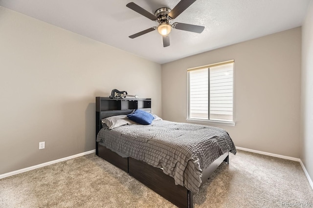 bedroom with carpet floors, baseboards, and ceiling fan