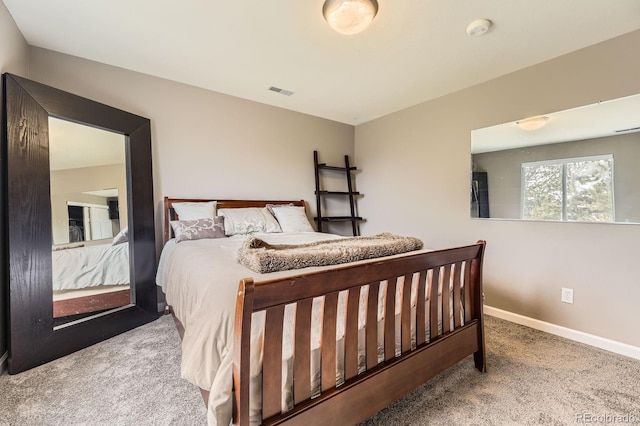 carpeted bedroom with baseboards