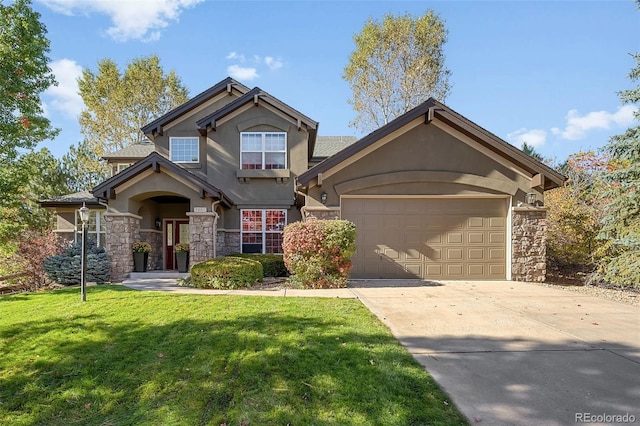 view of front of property with a garage and a front yard