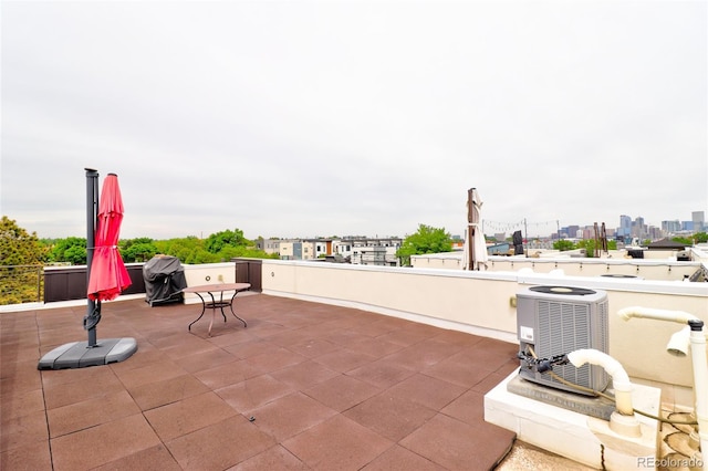 3404 W 18th Ave, Denver, CO 80204 - view of patio / terrace with central AC unit, a grill, and a city view