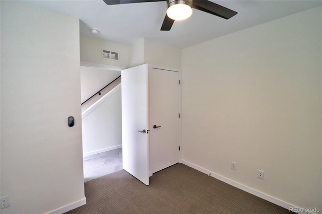 3404 W 18th Ave, Denver, CO 80204 - unfurnished bedroom featuring dark carpet, baseboards, and ceiling fan