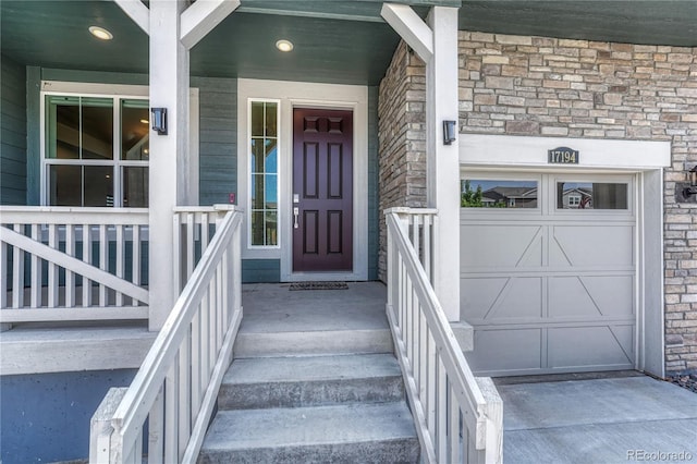 17194 Desert Wine Ln, Parker, CO 80134 - entrance to property featuring stone siding, a garage, and covered porch