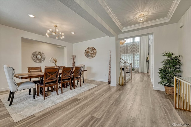 17194 Desert Wine Ln, Parker, CO 80134 - dining space featuring a chandelier, light wood-style floors, ornamental molding, and recessed lighting