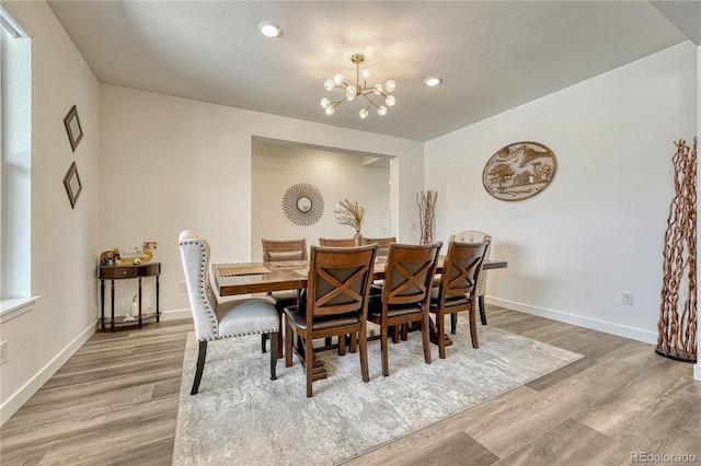 17194 Desert Wine Ln, Parker, CO 80134 - dining area featuring a chandelier, wood finished floors, and recessed lighting