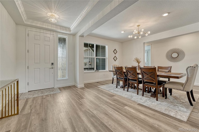 17194 Desert Wine Ln, Parker, CO 80134 - dining space with wood finished floors, a chandelier, a textured ceiling, a raised ceiling, and recessed lighting