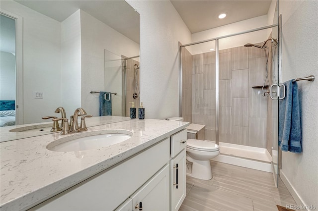 17194 Desert Wine Ln, Parker, CO 80134 - ensuite bathroom with vanity, a stall shower, and a textured wall