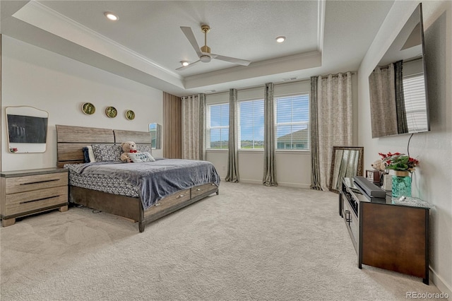 17194 Desert Wine Ln, Parker, CO 80134 - bedroom with a tray ceiling, crown molding, light carpet, ceiling fan, and recessed lighting