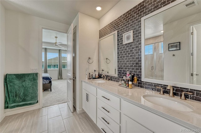 17194 Desert Wine Ln, Parker, CO 80134 - bathroom with healthy amount of natural light, double vanity, a shower stall, and connected bathroom