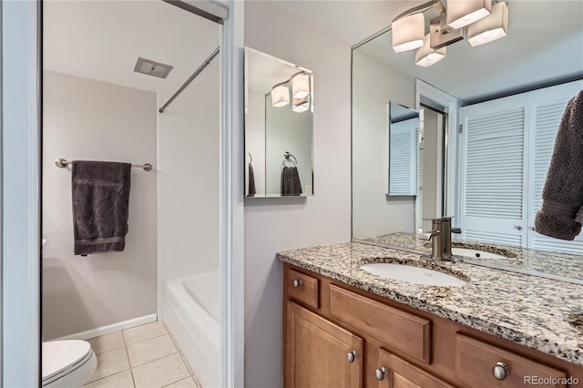 full bathroom featuring vanity, tile patterned floors, toilet, and bathtub / shower combination