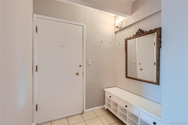 entryway with light tile patterned floors