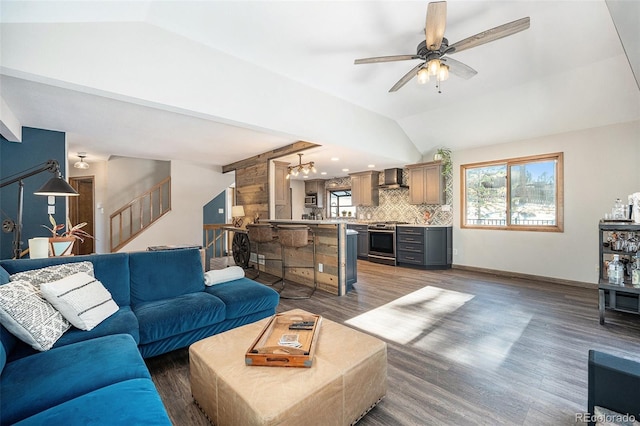 living room with ceiling fan, dark hardwood / wood-style flooring, and vaulted ceiling