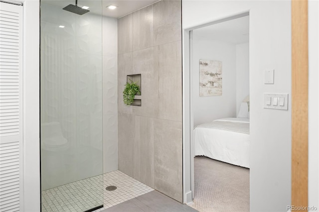 1755 Ingalls St, Lakewood, CO 80214 - full bathroom with a stall shower, a closet, ensuite bathroom, and tile patterned floors
