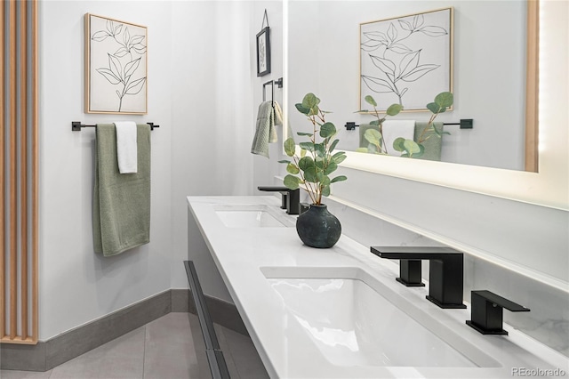 1755 Ingalls St, Lakewood, CO 80214 - bathroom with double vanity, tile patterned flooring, and baseboards