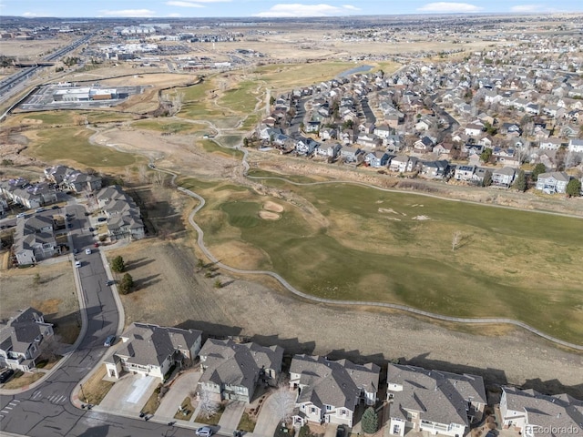 birds eye view of property featuring view of golf course and a residential view