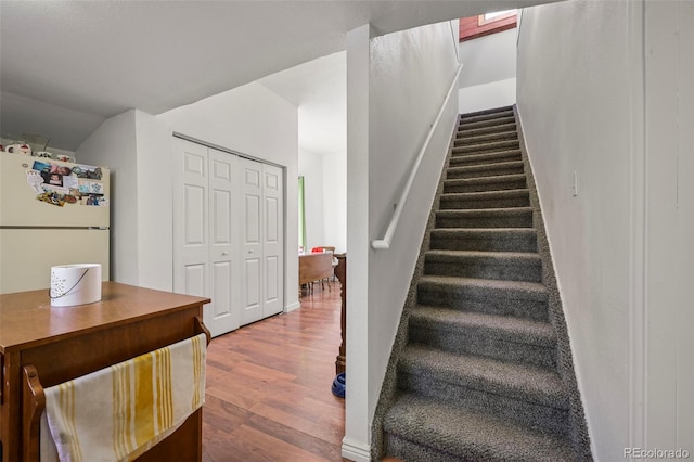 staircase featuring hardwood / wood-style flooring