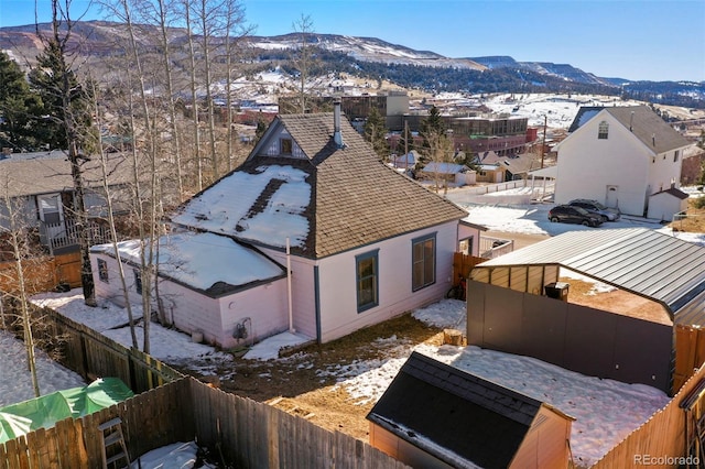 snowy aerial view with a mountain view