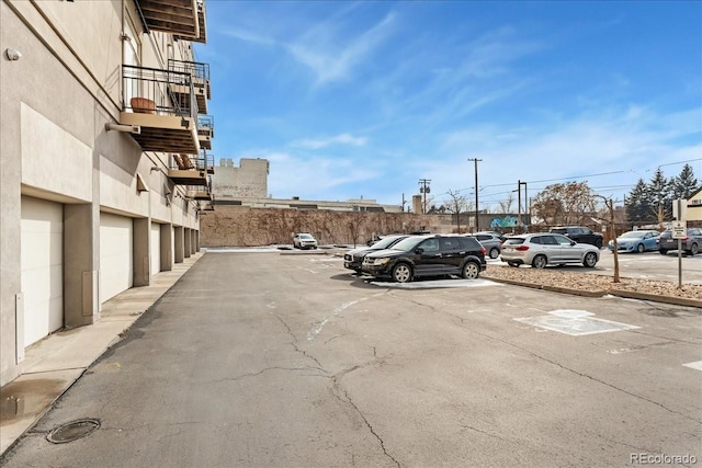 uncovered parking lot with community garages