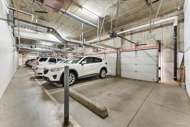 parking garage featuring a garage door opener