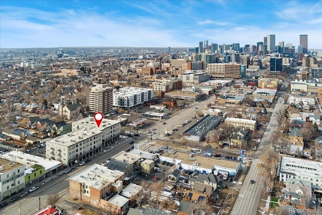 birds eye view of property with a view of city