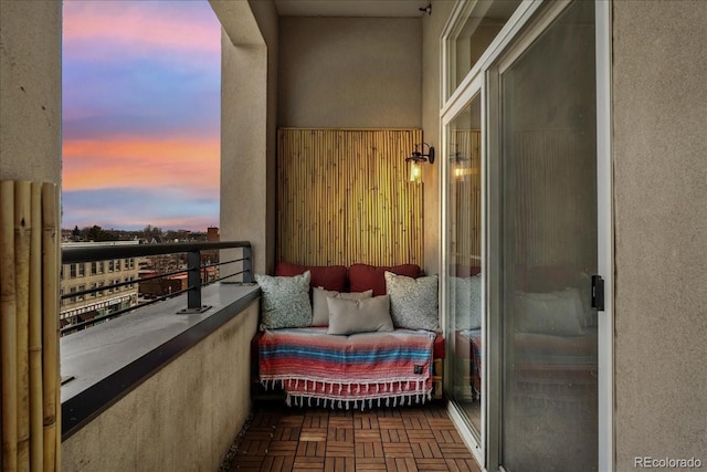 view of balcony at dusk