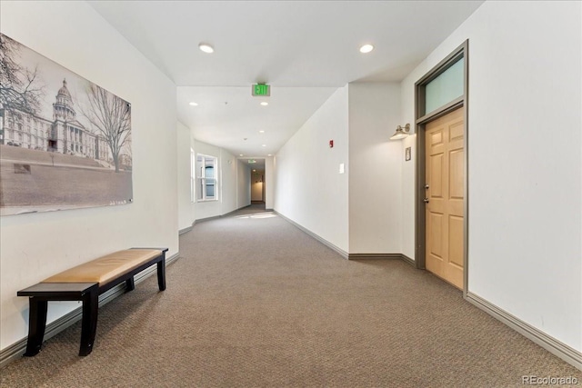 hall featuring recessed lighting, carpet flooring, and baseboards