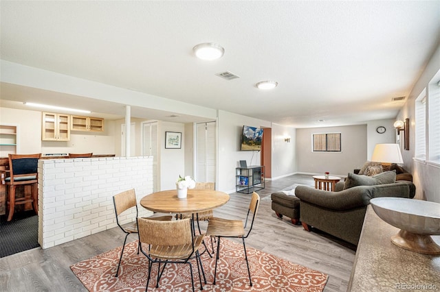 dining room featuring visible vents and light wood finished floors