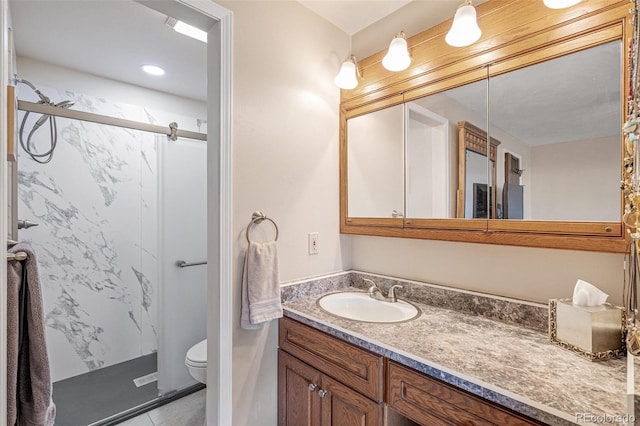 full bath with vanity, tile patterned floors, a shower stall, and toilet