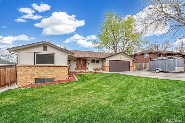 ranch-style home featuring a front lawn, fence, brick siding, an attached garage, and driveway
