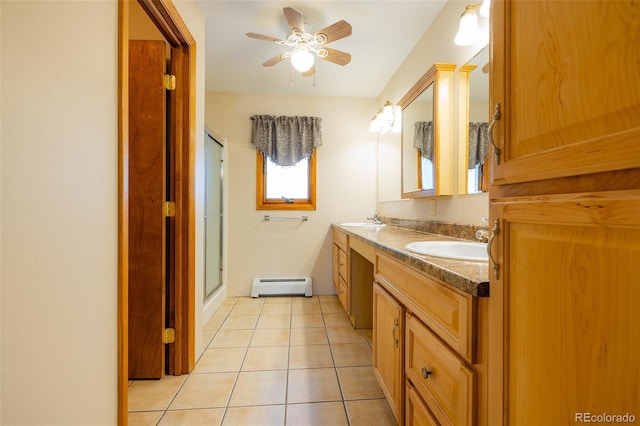 bathroom featuring walk in shower, vanity, baseboard heating, ceiling fan, and tile patterned flooring