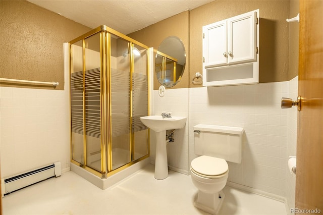 bathroom featuring walk in shower, sink, a baseboard radiator, concrete floors, and toilet