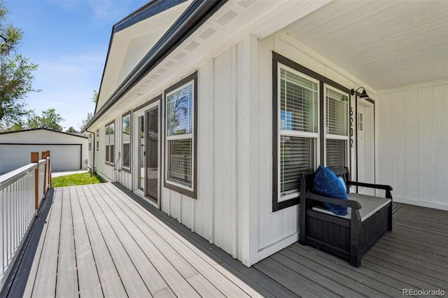 5202 Reed St, Arvada, CO 80002 - wooden terrace featuring a garage and an outbuilding