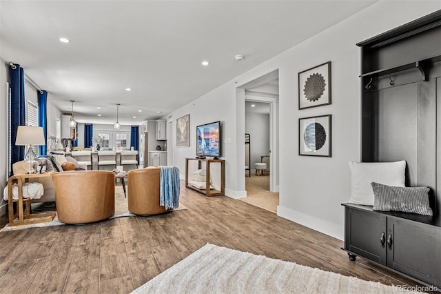 5202 Reed St, Arvada, CO 80002 - living area featuring wood finished floors, recessed lighting, and baseboards
