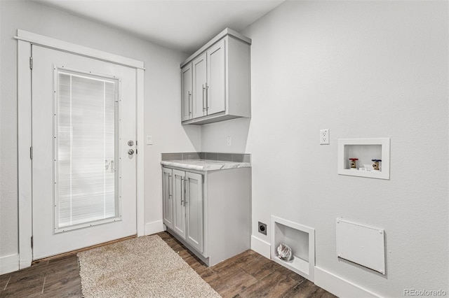5202 Reed St, Arvada, CO 80002 - laundry room with electric dryer hookup, hookup for a washing machine, cabinet space, dark wood finished floors, and baseboards