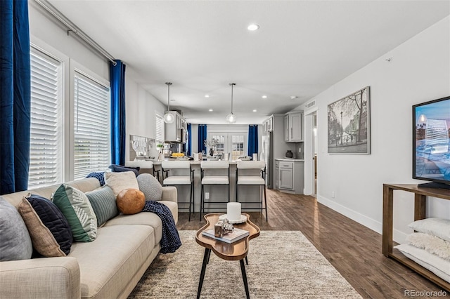 5202 Reed St, Arvada, CO 80002 - living area featuring recessed lighting, wood finished floors, and baseboards