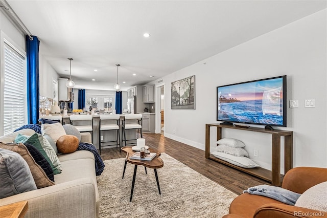 5202 Reed St, Arvada, CO 80002 - living room with wood finished floors, recessed lighting, and baseboards
