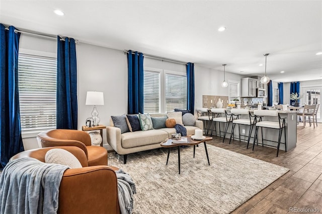 5202 Reed St, Arvada, CO 80002 - living room with recessed lighting, wood finished floors, and plenty of natural light