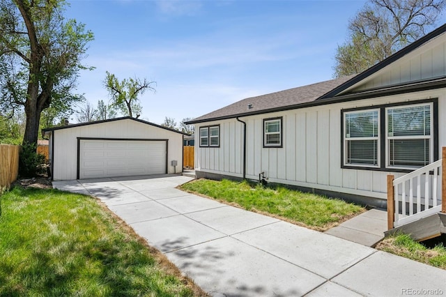 5202 Reed St, Arvada, CO 80002 - single story home featuring an outbuilding, fence, a garage, board and batten siding, and a shingled roof