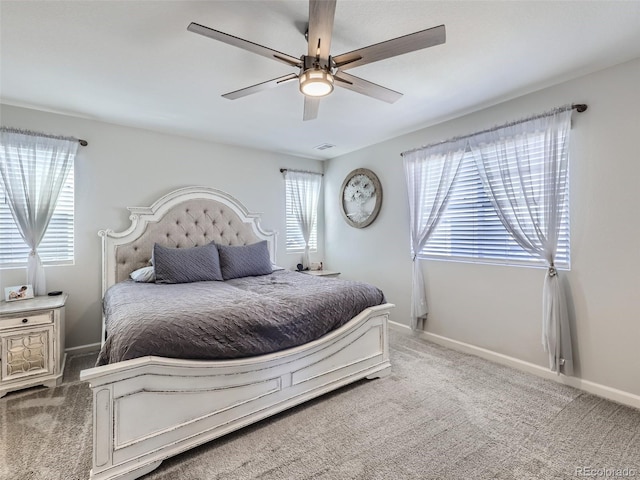 5995 Fencerow Pl, Brighton, CO 80601 - carpeted bedroom with baseboards and a ceiling fan