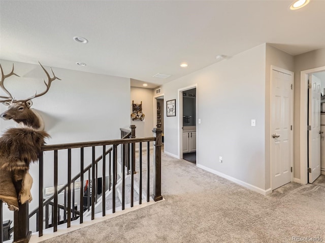 5995 Fencerow Pl, Brighton, CO 80601 - hall with an upstairs landing, carpet flooring, baseboards, and recessed lighting