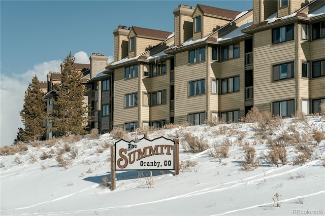 view of snow covered property