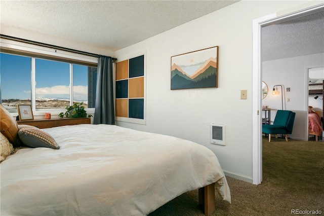 carpeted bedroom with a textured ceiling