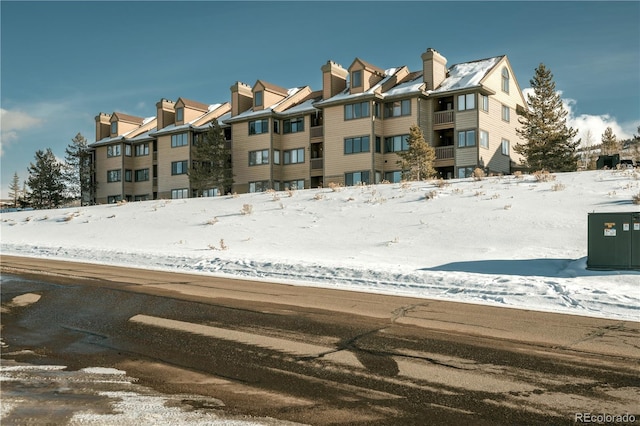 view of snow covered property