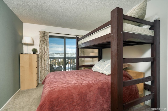 carpeted bedroom with a textured ceiling