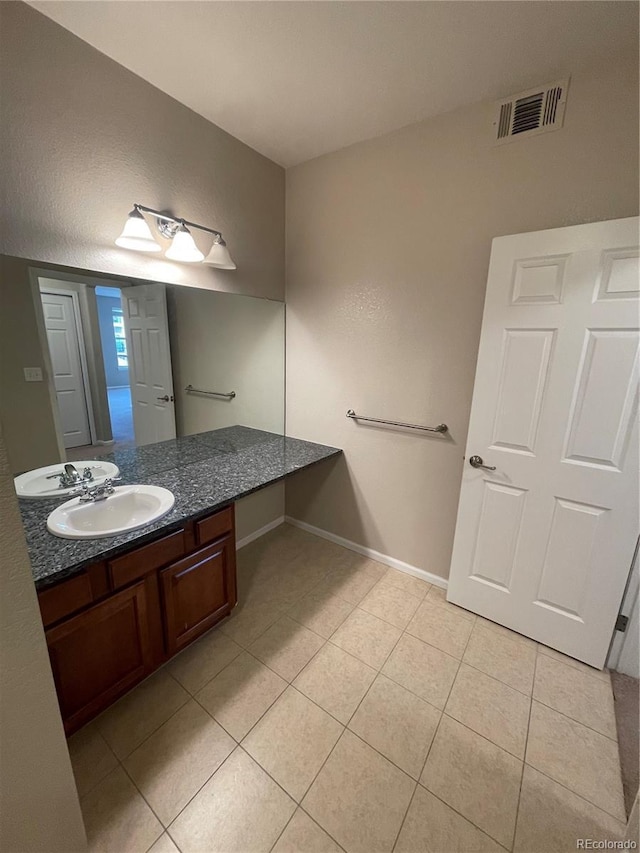17346 Nature Walk Trl Unit 201, Parker, CO 80134 - bathroom featuring vanity, tile patterned flooring, and baseboards
