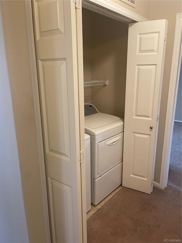 17346 Nature Walk Trl Unit 201, Parker, CO 80134 - washroom featuring light carpet and independent washer and dryer