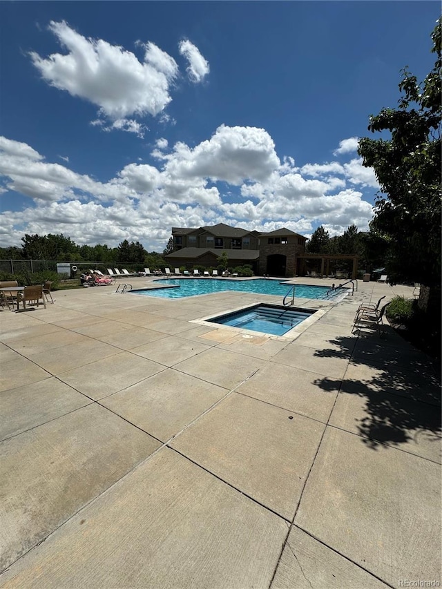 17346 Nature Walk Trl Unit 201, Parker, CO 80134 - community pool with a hot tub and a patio area