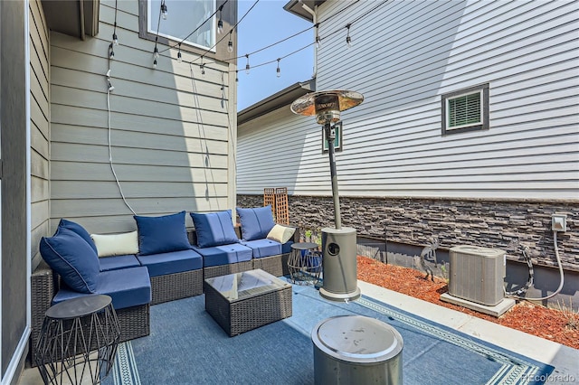 view of patio / terrace with an outdoor hangout area and central air condition unit