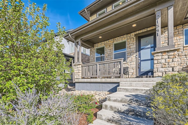 entrance to property featuring a porch