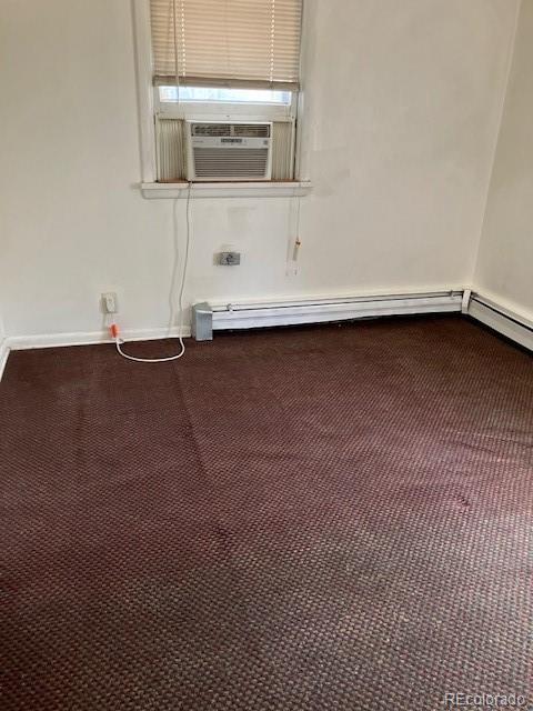 420 E 45th Ave, Denver, CO 80216 - carpeted empty room with cooling unit, a baseboard radiator, and baseboards