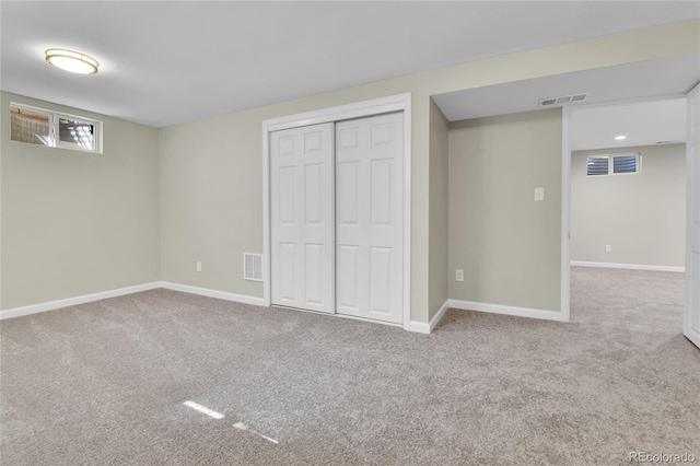 basement with light colored carpet